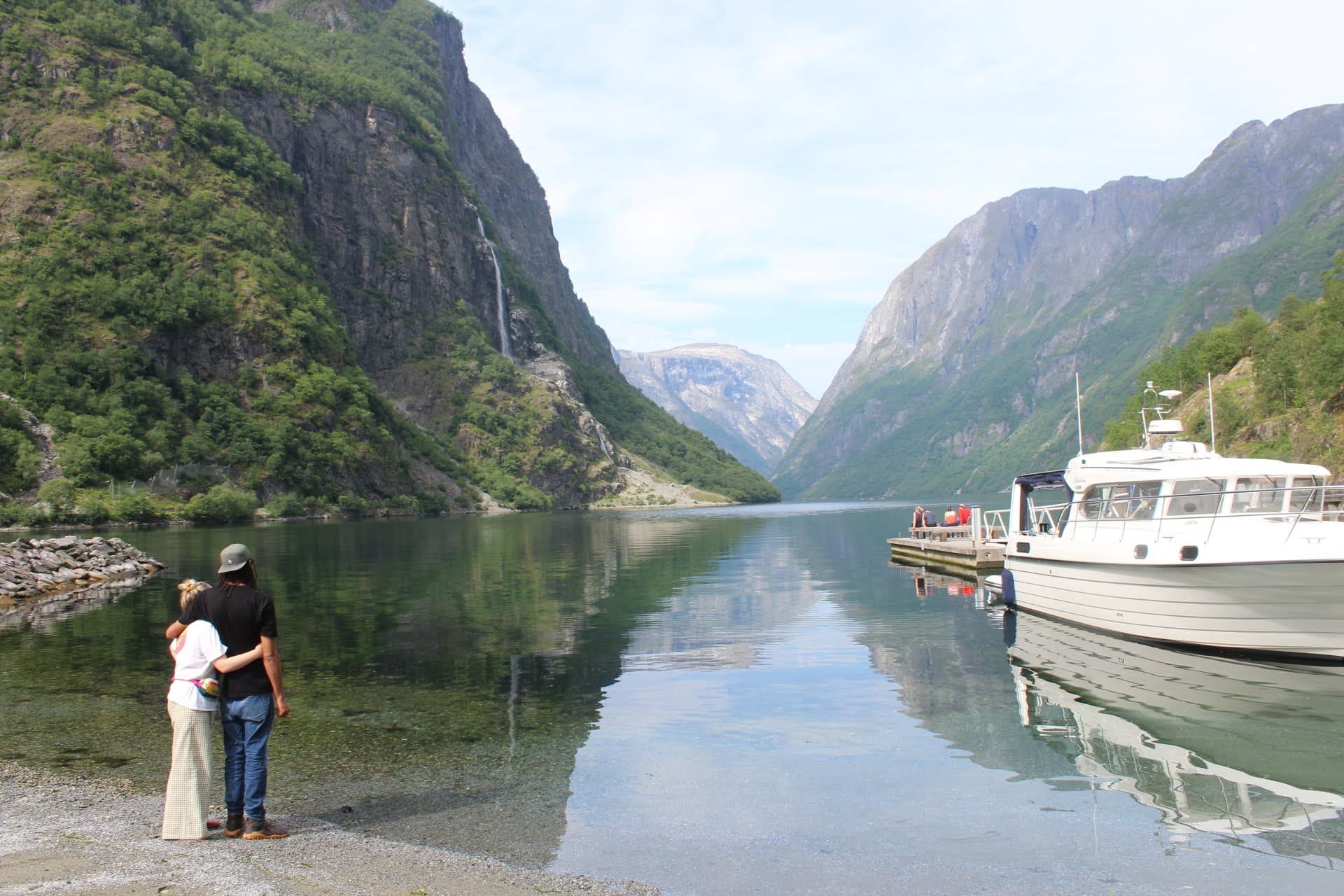 Kez and J looking out onto a fjord