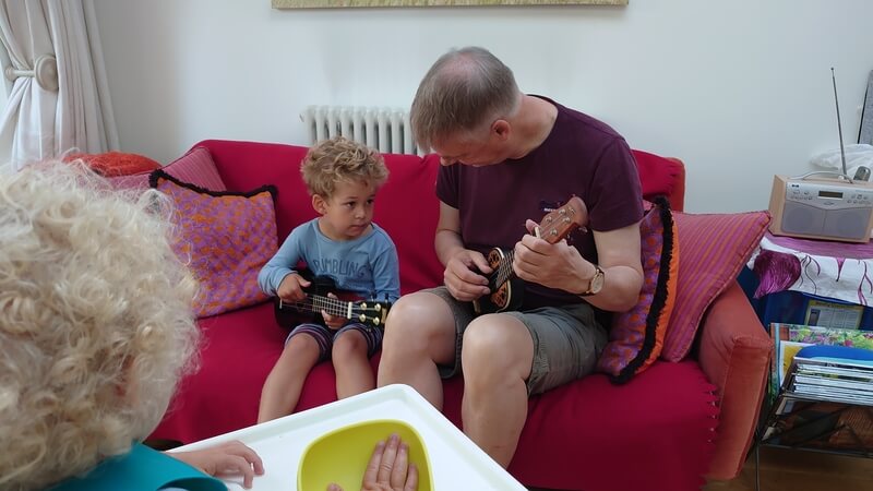 Marley and Grandad playing the Ukelele